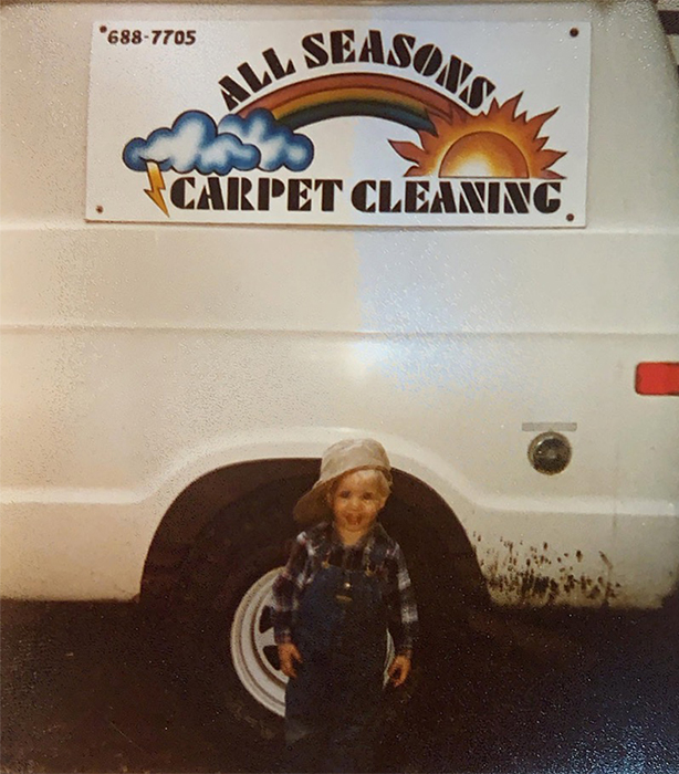 Little Mark in front of the family carpet cleaning van