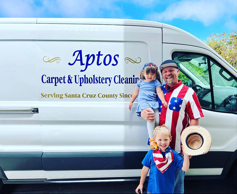 Mark Morris with his children beside the Aptos Carpet & Upholstery Cleaning van